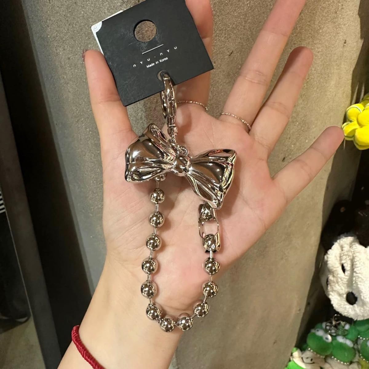 S.A.V.I Bow Keychain for Women, Silver Metal Bag Charm with Bead Chain, Round clasp accessory for handbags, backpacks & keys; stylish gift with glossy finish for girls and teens.