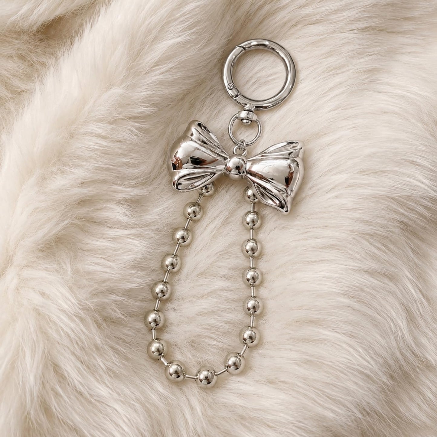 S.A.V.I Bow Keychain for Women, Silver Metal Bag Charm with Bead Chain, Round clasp accessory for handbags, backpacks & keys; stylish gift with glossy finish for girls and teens.