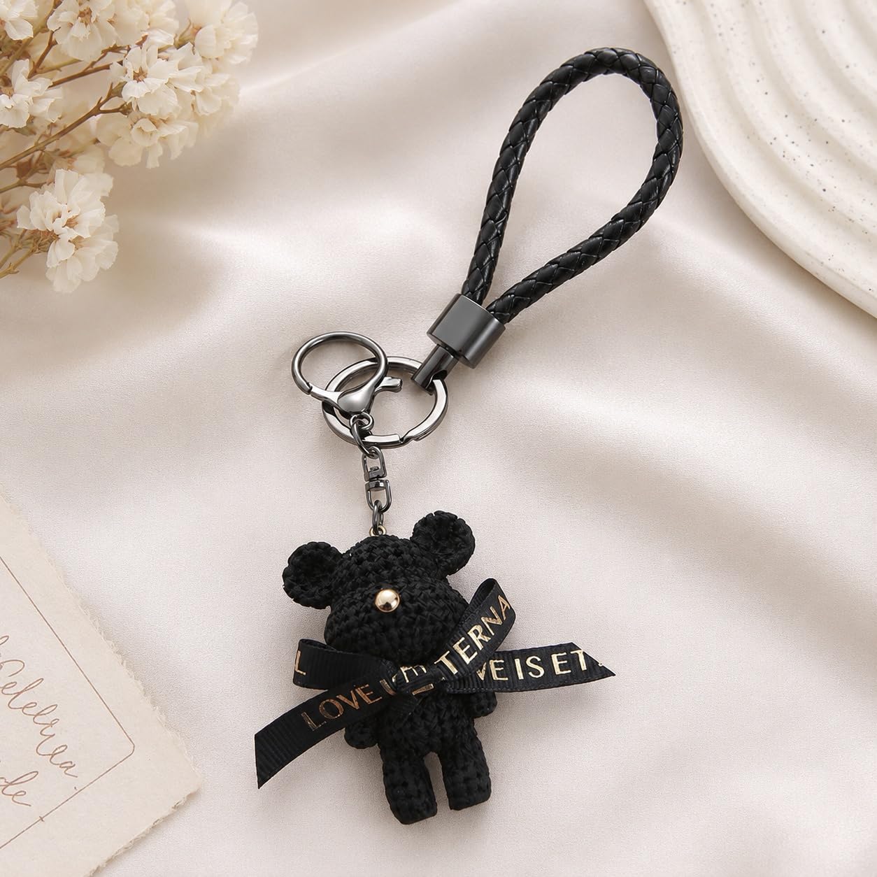 S.A.V.I Teddy Bear Keychain Black Bag Charm for Women & Girls | Braided Wrist Strap, Resin Figurine, Bell Pendant, 7 x 3.5 cm Size, 9.5 cm Loop